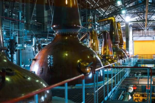 Copper pot stills in the still house at Suntory Hakushu Distillery, Japan