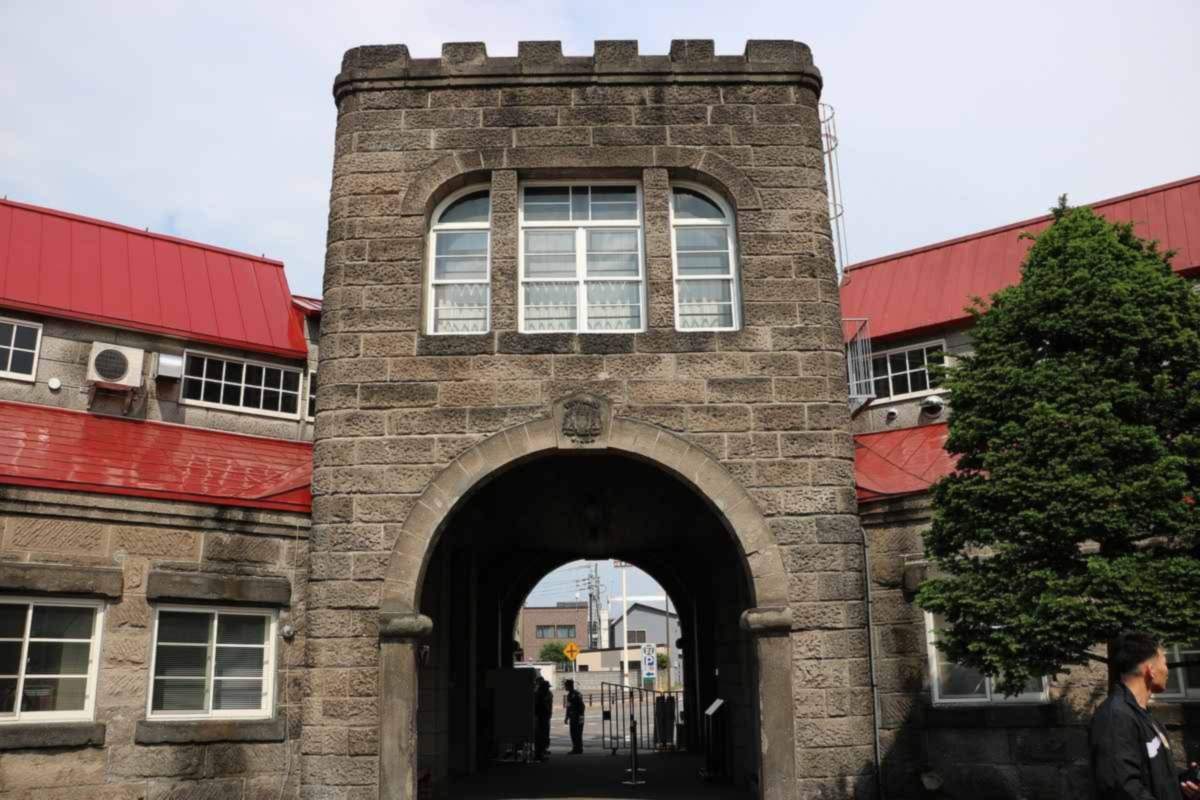 Stone gate of Nikka's Yoichi distillery in Hokkaido, a key stop in any Japanese whisky guide