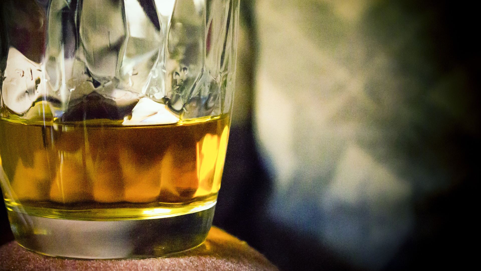 A dram of whisky poured into a tasting glass, illustrating how to drink whisky