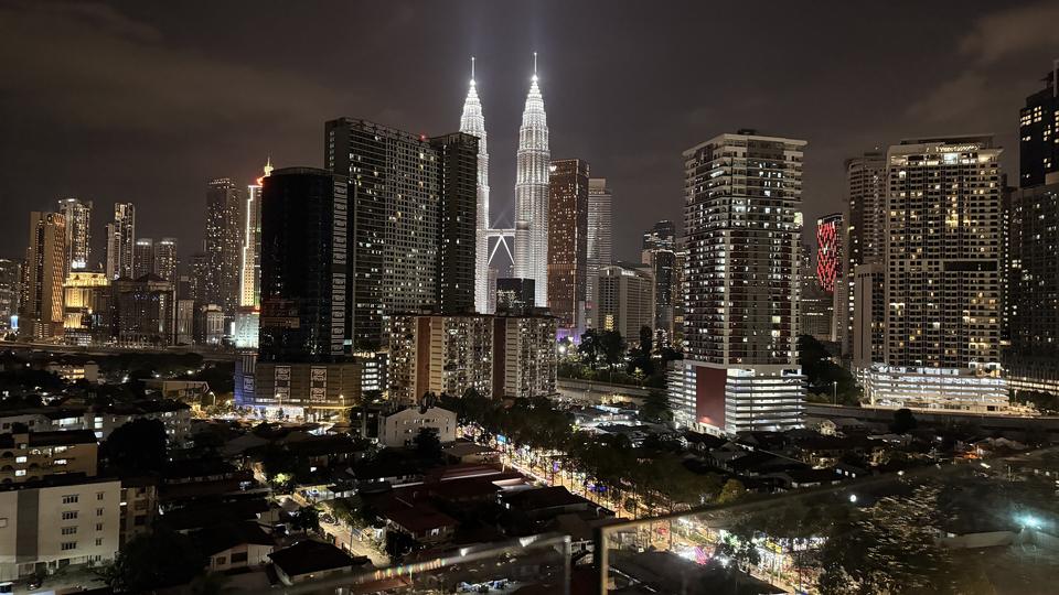 Kuala Lumpur skyline at night, where most whisky Malaysia shoppers buy their bottles