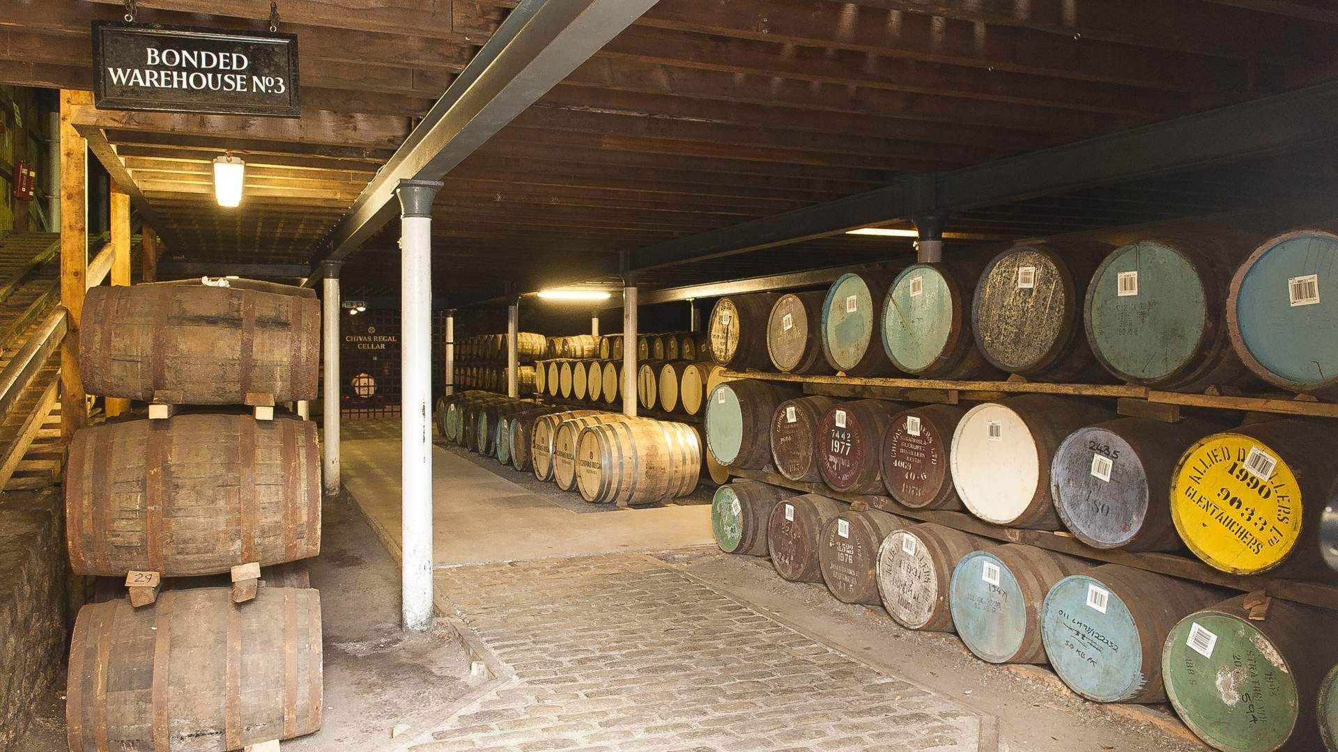 Casks in a bonded warehouse, illustrating how whisky tax in Malaysia is worked out per litre of alcohol