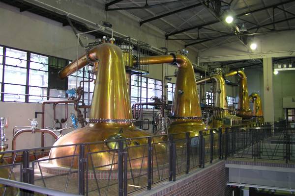 Row of copper pot stills in the still house at Suntory Yamazaki Distillery, Japan